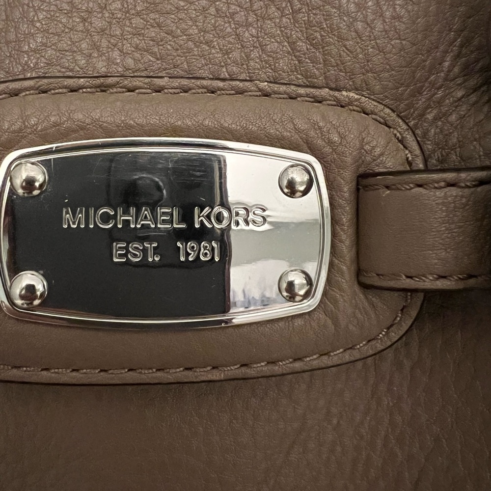 Michael Kors purse. Can be a shoulder bag or a crossbody.